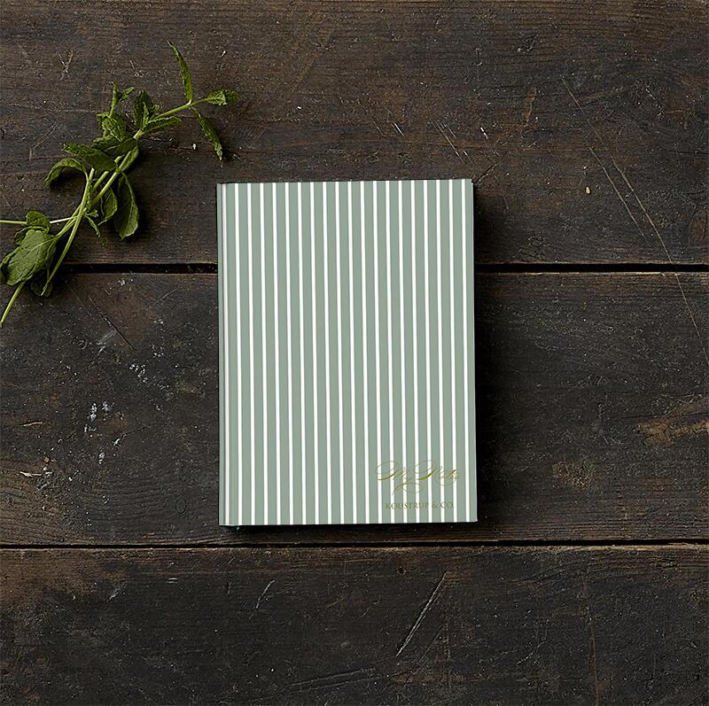 Small green sketch book with lines